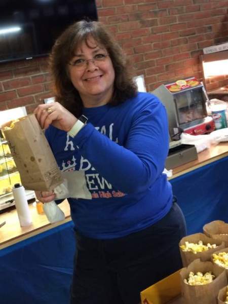 Large image of photo: She's popped her last bag of popcorn for the Boosters! Thanks for all you've done over the years